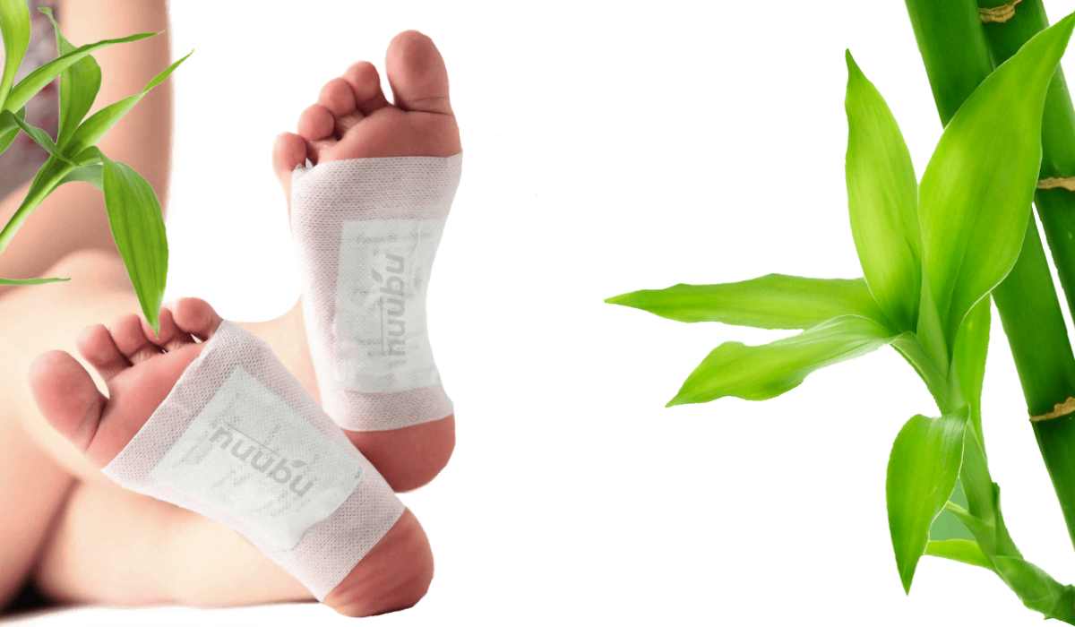 Feet with Nuubu detox patches and bamboo in the background